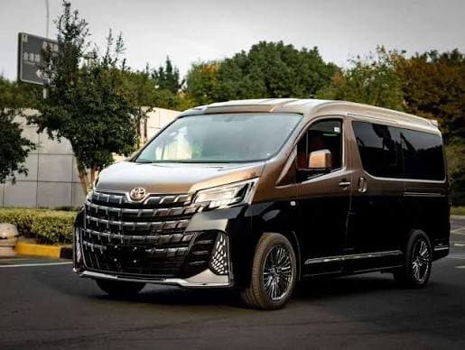 Hiace Grand Cabin Group Van · 2025/2026 - 11 passengers, 12 luggage capacity. The workhorse of Umrah transport — eleven seats, a full-height cabin you can stand in, and curtains for privacy and shade on the Makkah–Madinah road.